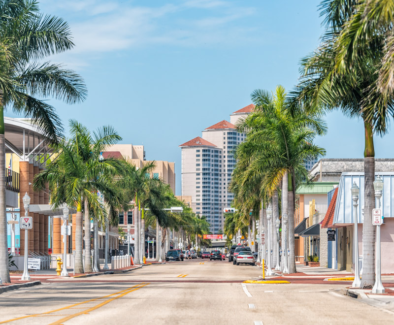 Fort Myers, USA - April 29, 2018: City town street during sunny